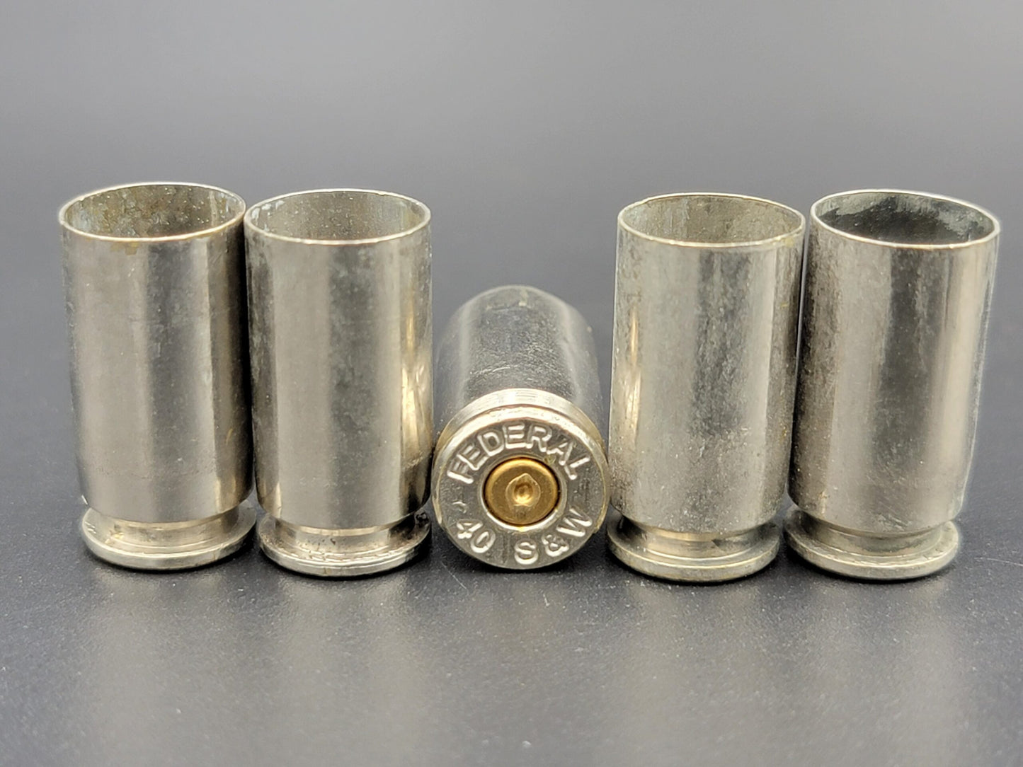 40 S&W once fired pistol nickel. Hand sorted from reputable indoor/military ranges for reloading. Reliable spent casings for precision shooting.